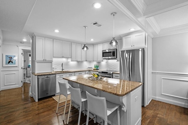 71 Weatherly Unit 71, Salem, MA 01970 - kitchen featuring appliances with stainless steel finishes, a sink, crown molding, dark wood finished floors, and recessed lighting