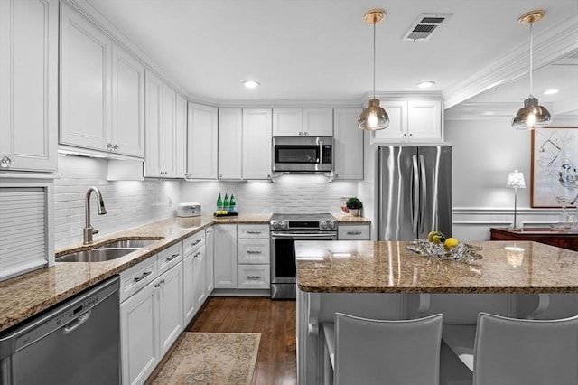 71 Weatherly Unit 71, Salem, MA 01970 - kitchen with stainless steel appliances, a sink, white cabinetry, dark wood finished floors, and stone countertops