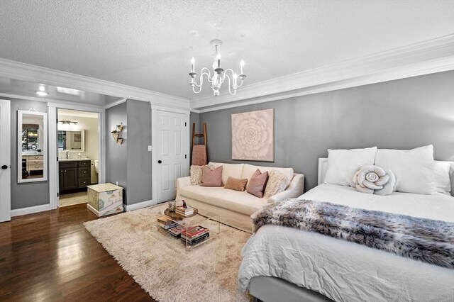 71 Weatherly Unit 71, Salem, MA 01970 - bedroom with a chandelier, ornamental molding, wood finished floors, a textured ceiling, and ensuite bath
