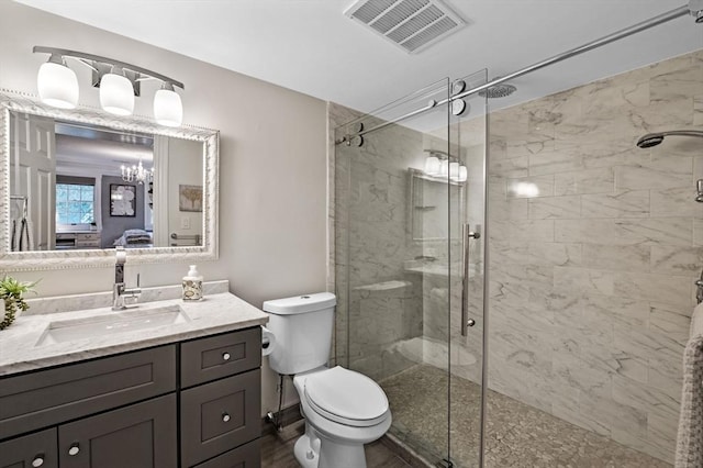 71 Weatherly Unit 71, Salem, MA 01970 - bathroom featuring a shower stall, vanity, toilet, a chandelier, and ensuite bath
