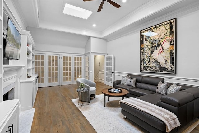 71 Weatherly Unit 71, Salem, MA 01970 - living room featuring ceiling fan, french doors, a raised ceiling, wood finished floors, and a fireplace