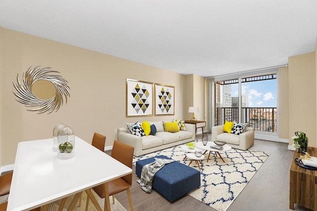 living room featuring floor to ceiling windows and wood-type flooring