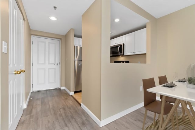 hall featuring light hardwood / wood-style floors