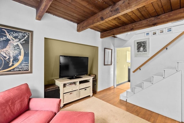 living room with wooden ceiling, beamed ceiling, and light hardwood / wood-style floors