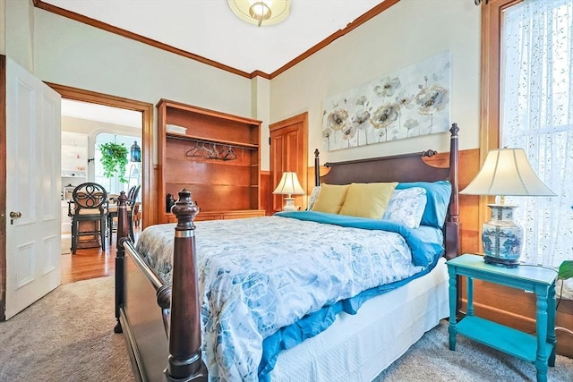 carpeted bedroom with crown molding