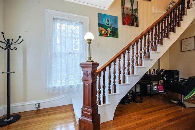 stairs with hardwood / wood-style floors