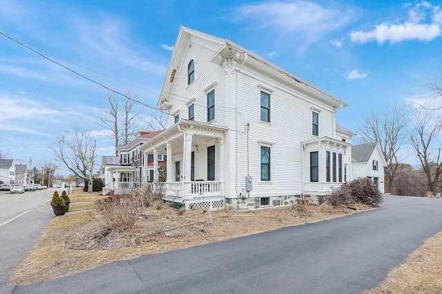 view of home's exterior featuring covered porch