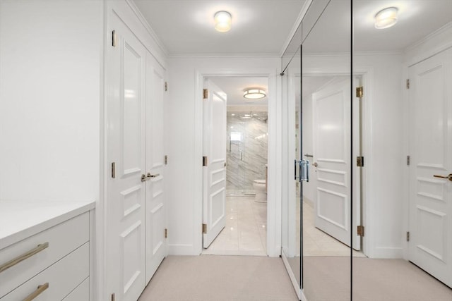 2 Commonwealth Ave Unit 15D, Boston, MA 02116 - hallway featuring light tile patterned floors, light colored carpet, and crown molding