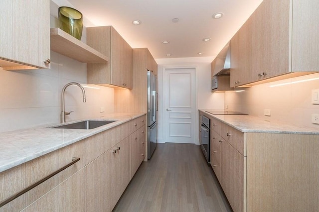 2 Commonwealth Ave Unit 15D, Boston, MA 02116 - kitchen with a sink, wall oven, high quality fridge, light wood finished floors, and light stone counters