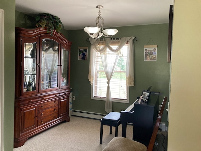 living area with an inviting chandelier, carpet flooring, and a baseboard heating unit