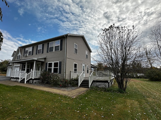 view of front facade featuring a front lawn and a garage