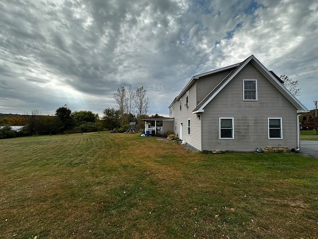 view of side of property featuring a yard