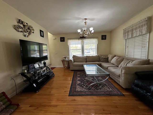 living room with a chandelier and hardwood / wood-style floors