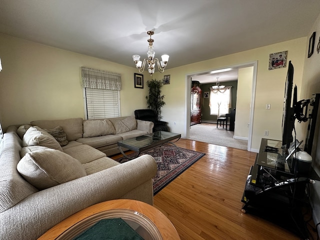 living room featuring hardwood / wood-style floors and a chandelier