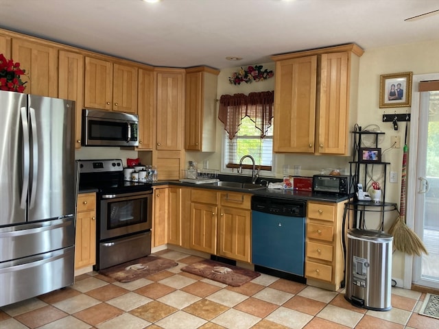 kitchen featuring appliances with stainless steel finishes and sink