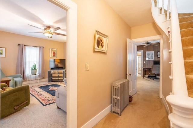 46 Pleasant St, Southbridge, MA 01550 - hallway featuring radiator, light carpet, stairway, and baseboards