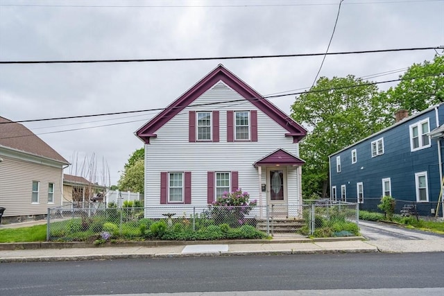 46 Pleasant St, Southbridge, MA 01550 - view of front of house with a fenced front yard