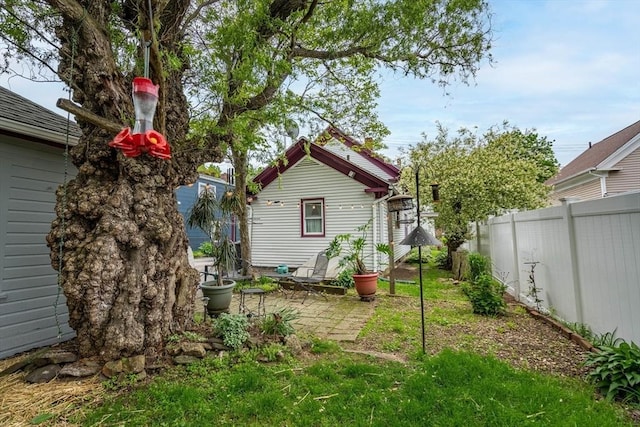 46 Pleasant St, Southbridge, MA 01550 - rear view of house with a patio