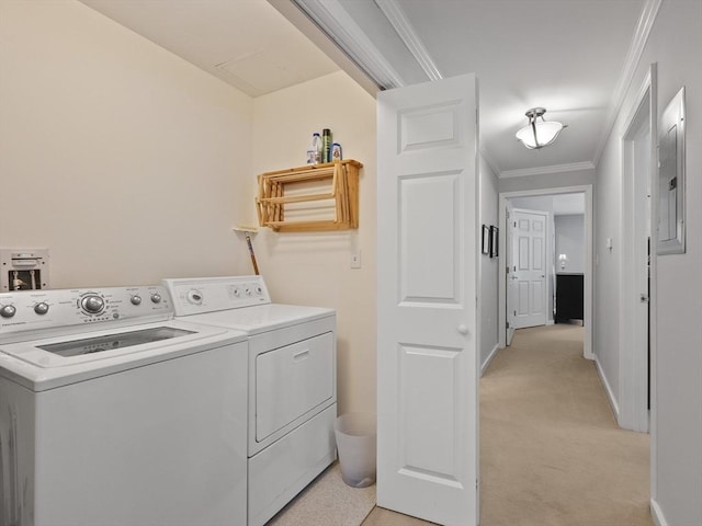 laundry area with washing machine and dryer, ornamental molding, light colored carpet, and electric panel