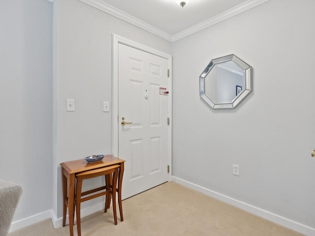 entryway featuring ornamental molding and light carpet