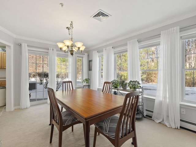 dining area featuring light carpet, crown molding, and a chandelier