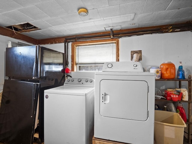 laundry room featuring washer and dryer and laundry area