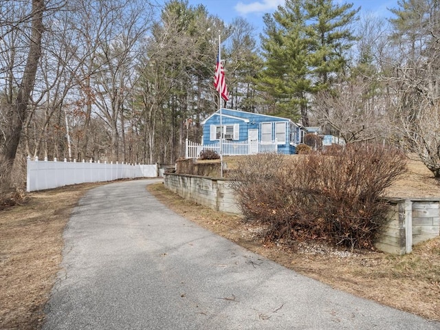 view of side of home with fence