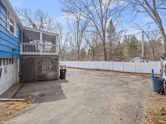 view of yard with a deck and fence