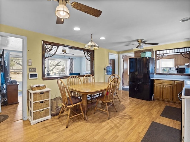 dining area featuring recessed lighting, plenty of natural light, light wood-style flooring, and a ceiling fan