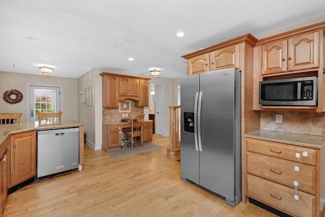 768 Plymouth St, Abington, MA 02351 - kitchen with stainless steel appliances, light wood-style flooring, tasteful backsplash, and recessed lighting