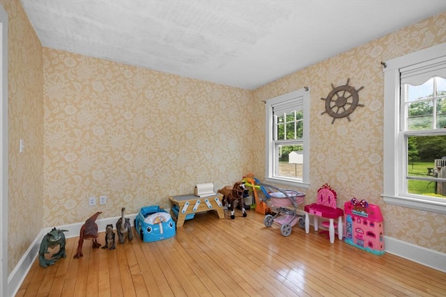768 Plymouth St, Abington, MA 02351 - game room with hardwood / wood-style flooring, healthy amount of natural light, wallpapered walls, and baseboards
