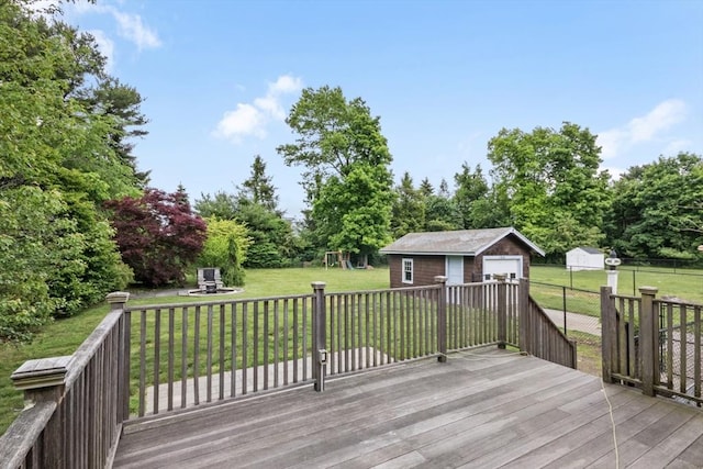 768 Plymouth St, Abington, MA 02351 - wooden deck with a playground, an outbuilding, and a detached garage