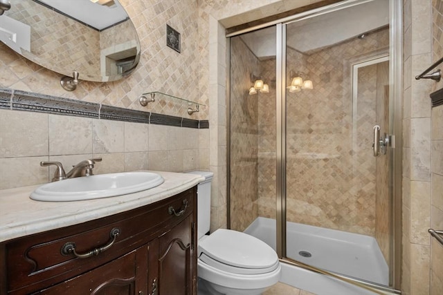 768 Plymouth St, Abington, MA 02351 - full bath with tile walls, toilet, vanity, a shower stall, and backsplash