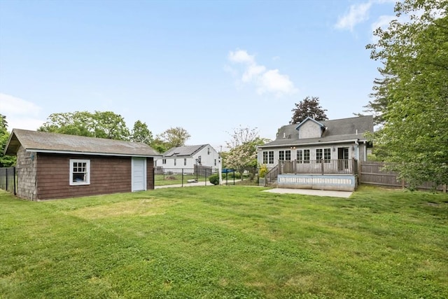 768 Plymouth St, Abington, MA 02351 - view of yard featuring a deck and an outbuilding