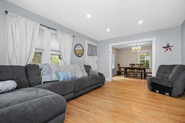 768 Plymouth St, Abington, MA 02351 - living room with a chandelier, light wood-type flooring, recessed lighting, and baseboards