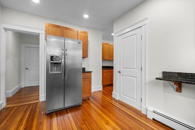 37 Fountain Rd Unit 1, Arlington, MA 02476 - kitchen featuring stainless steel fridge with ice dispenser, baseboard heating, dark wood-style floors, recessed lighting, and brown cabinetry