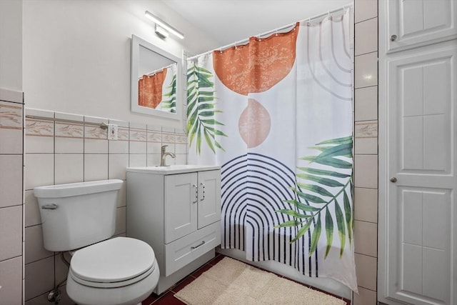 37 Fountain Rd Unit 1, Arlington, MA 02476 - full bath with vanity, toilet, tile walls, a shower with curtain, and a wainscoted wall