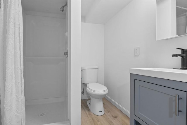 37 Fountain Rd Unit 1, Arlington, MA 02476 - full bath featuring wood finished floors, vanity, a shower stall, and toilet