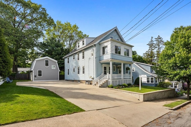 37 Fountain Rd Unit 1, Arlington, MA 02476 - view of front facade featuring a porch, a front lawn, and driveway