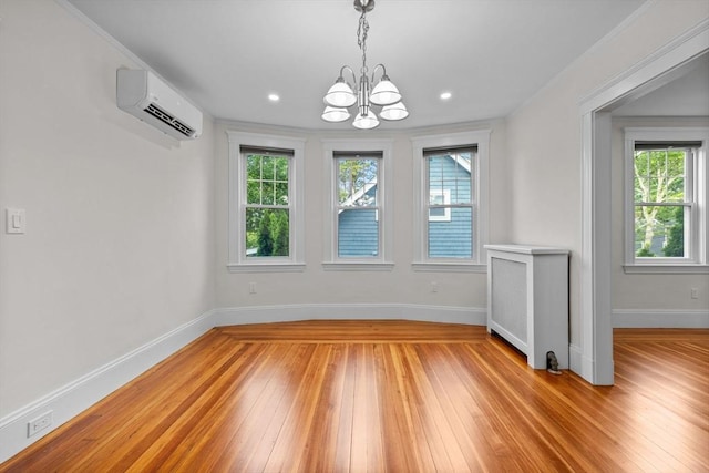 37 Fountain Rd Unit 1, Arlington, MA 02476 - unfurnished dining area featuring a wall mounted AC, a chandelier, healthy amount of natural light, baseboards, and recessed lighting