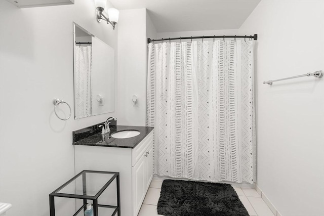 bathroom with vanity and tile patterned flooring