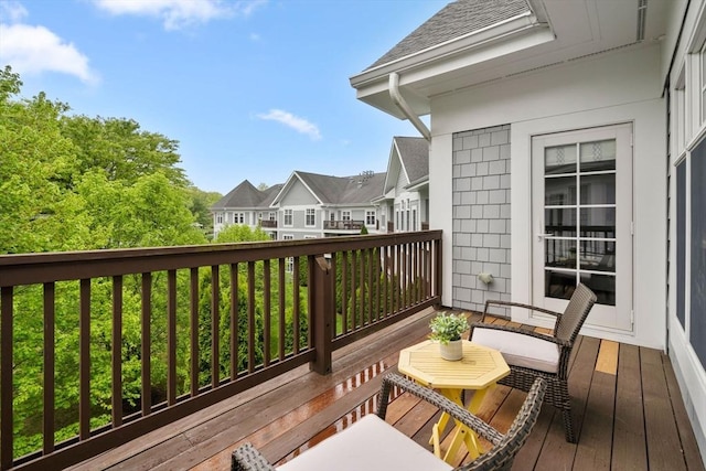 wooden terrace with a residential view
