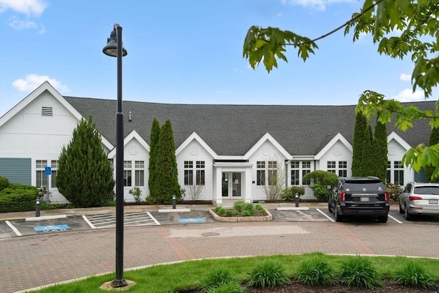 view of property with uncovered parking