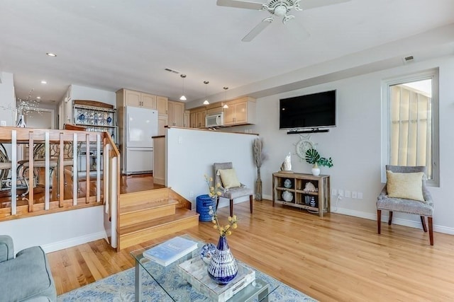 40 Oceanside Dr Unit 40, Hull, MA 02045 - living room featuring light wood-type flooring, a ceiling fan, recessed lighting, and stairs