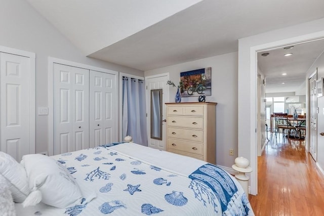 40 Oceanside Dr Unit 40, Hull, MA 02045 - bedroom with light wood-style floors, recessed lighting, and two closets