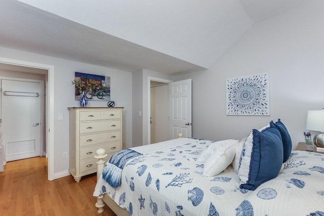40 Oceanside Dr Unit 40, Hull, MA 02045 - bedroom featuring light wood-style flooring and lofted ceiling