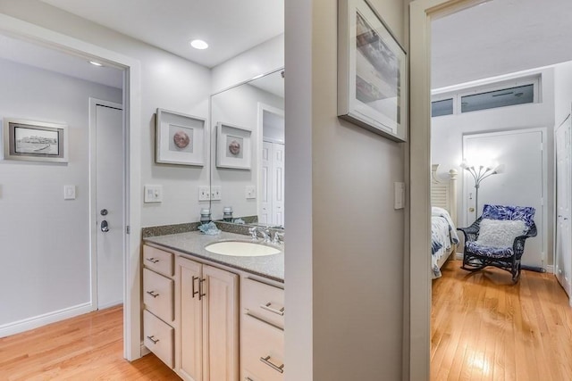 40 Oceanside Dr Unit 40, Hull, MA 02045 - bathroom featuring vanity, wood finished floors, and ensuite bathroom
