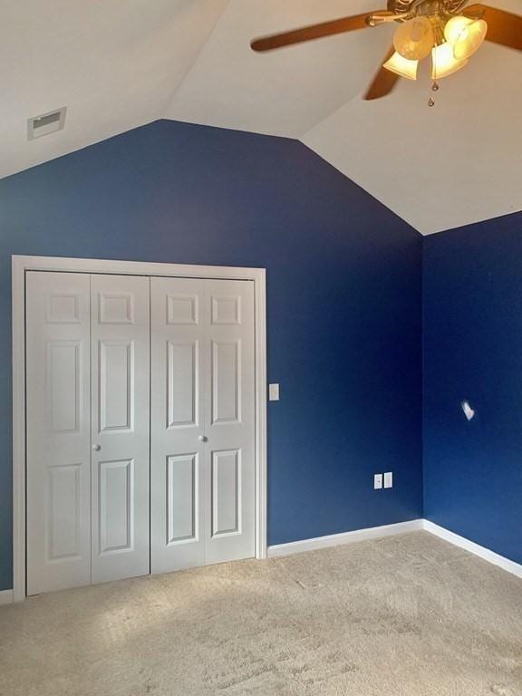additional living space with a ceiling fan, carpet floors, lofted ceiling, and baseboards