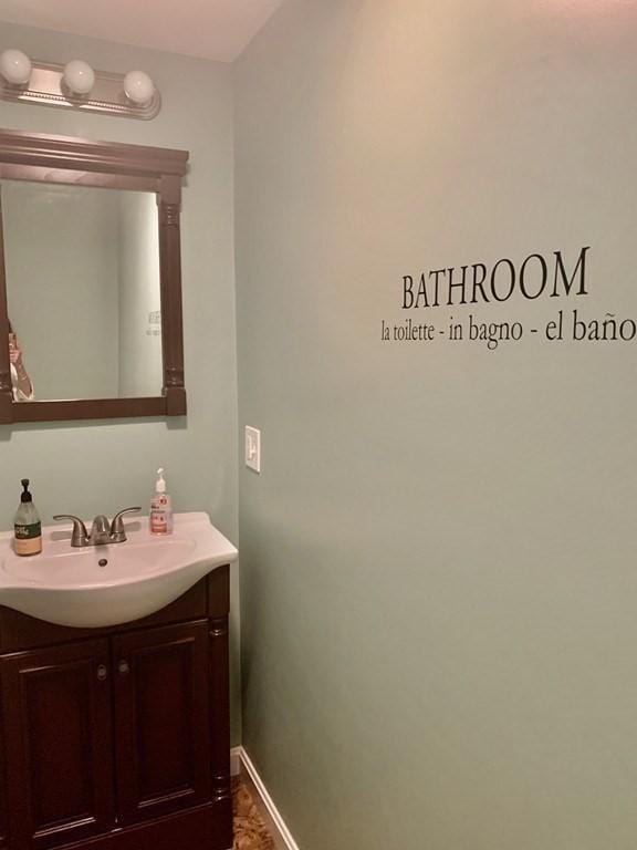 bathroom with vanity and baseboards