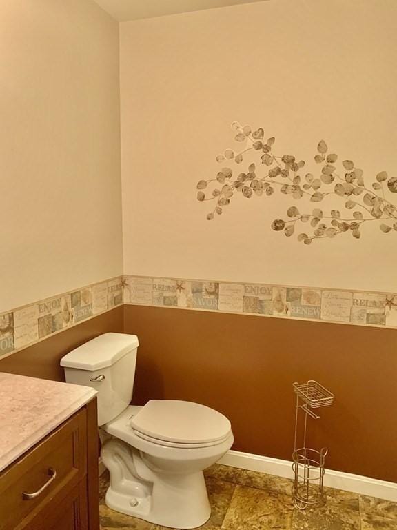 bathroom featuring toilet and vanity